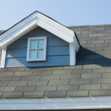 https://stock.adobe.com/images/windows-at-the-roof-of-the-house-new-roof-under-construction-roof-shingles-on-top-of-the-house-against-sky/243225275?prev_url=detail