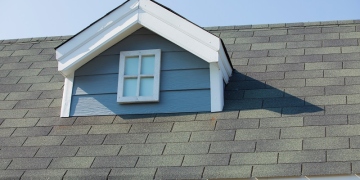 https://stock.adobe.com/images/windows-at-the-roof-of-the-house-new-roof-under-construction-roof-shingles-on-top-of-the-house-against-sky/243225275?prev_url=detail